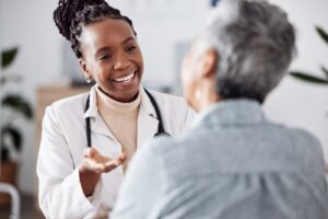 A healthcare professional smiling with a patient