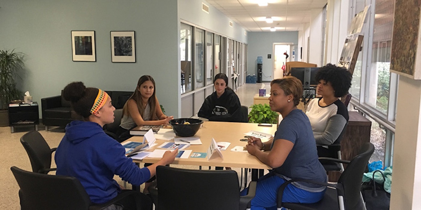 Group meeting by a table.