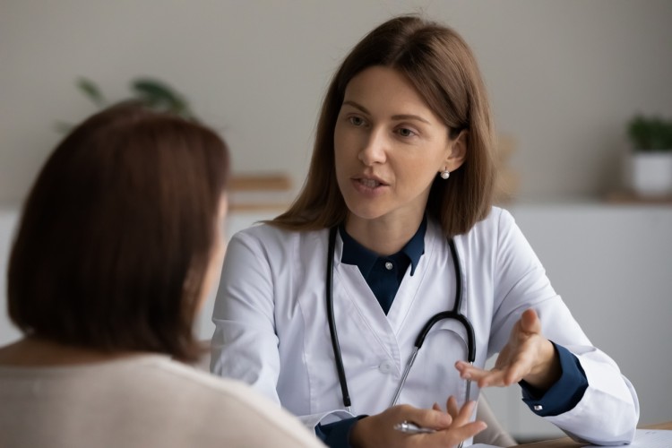 A physician has a discussion with a patient.