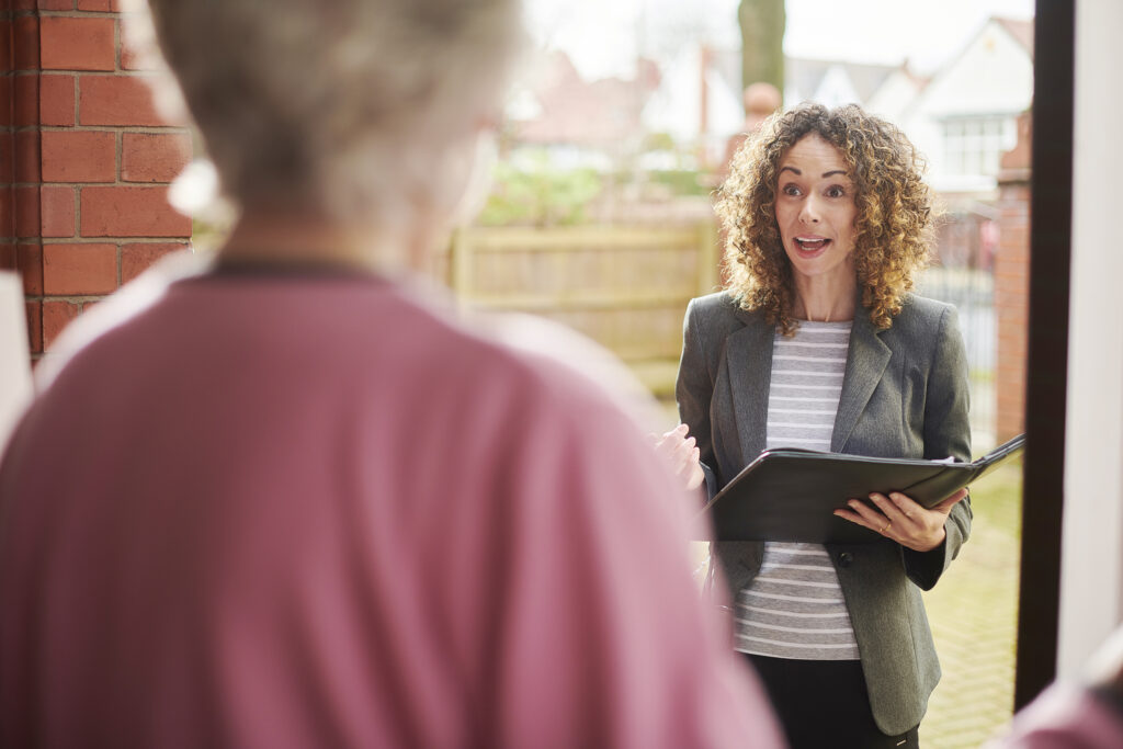 A community health manager makes an in-home visit.